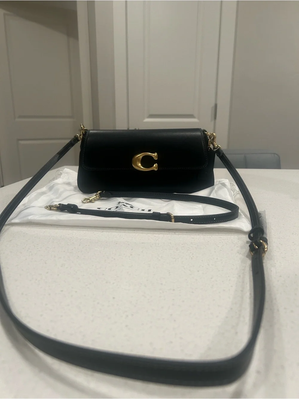 Coach Black Leather Crossbody with Gold 'C' Accent